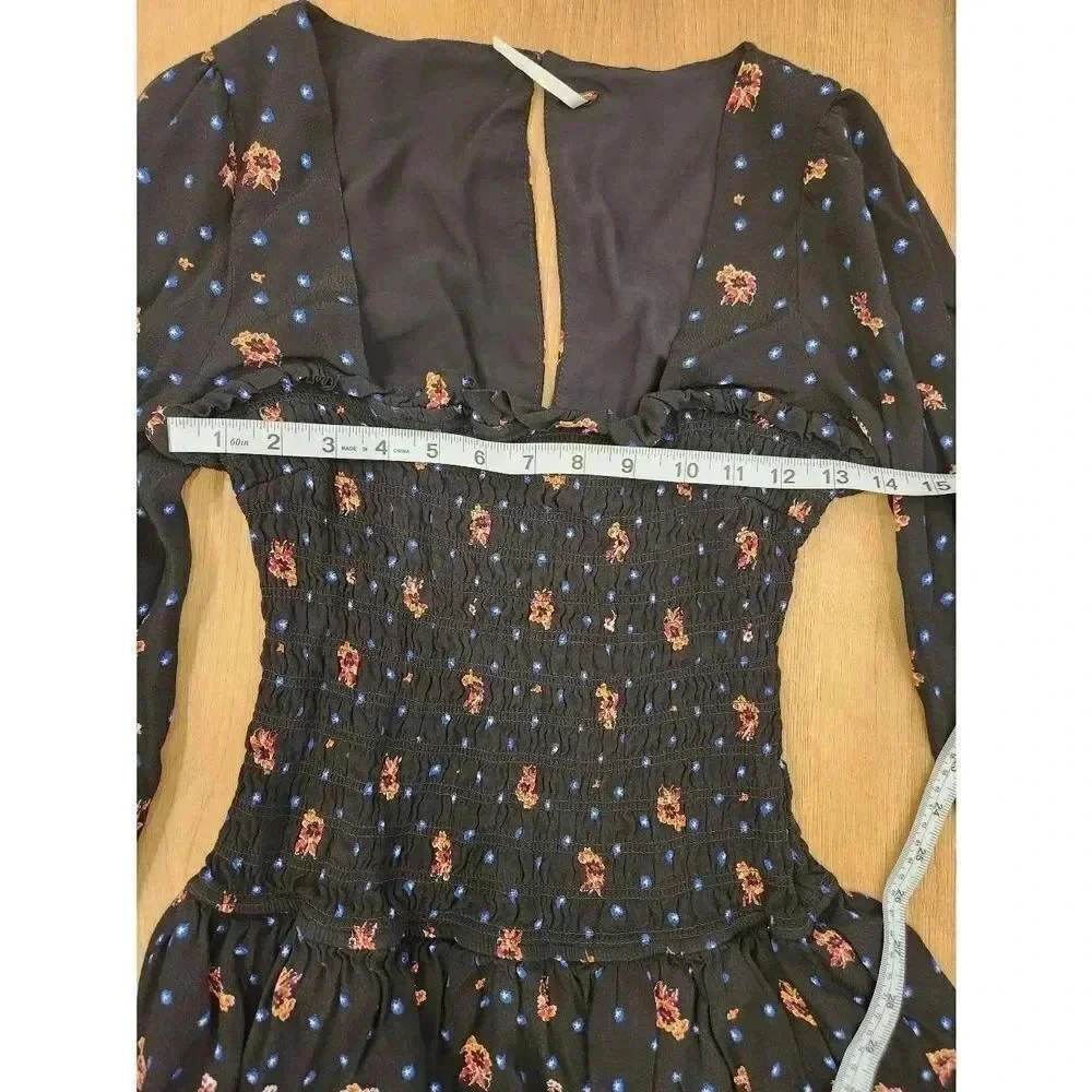 Free People Two Faces Smocked Bodice Floral Mini Dress Long Sleeved Size XS.